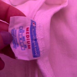 Medium sized champion T-shirt. Never worn